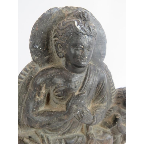 6 - An antique Indo-Greek carved hardstone figure of a seated Buddha with a praying attendant. Indian su... 