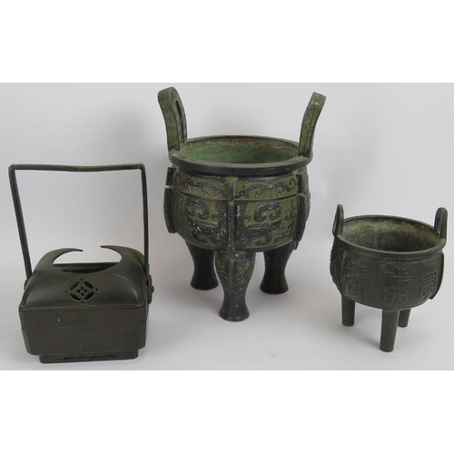 61 - Three Chinese bronze censers, two with tripod feet and decorative bodies and one of square form with... 