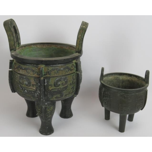 61 - Three Chinese bronze censers, two with tripod feet and decorative bodies and one of square form with... 