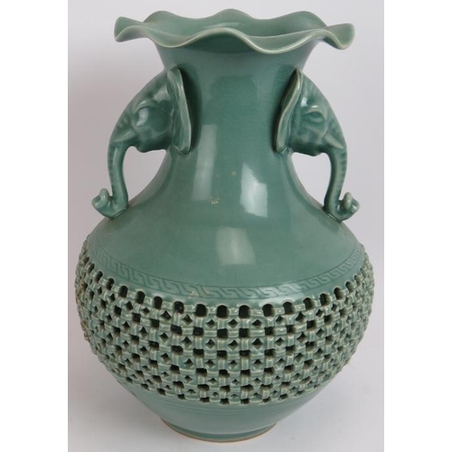 66 - A Chinese celadon glaze porcelain baluster vase of double wall construction with reticulated outer a... 