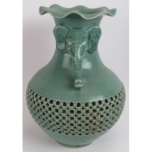 66 - A Chinese celadon glaze porcelain baluster vase of double wall construction with reticulated outer a... 