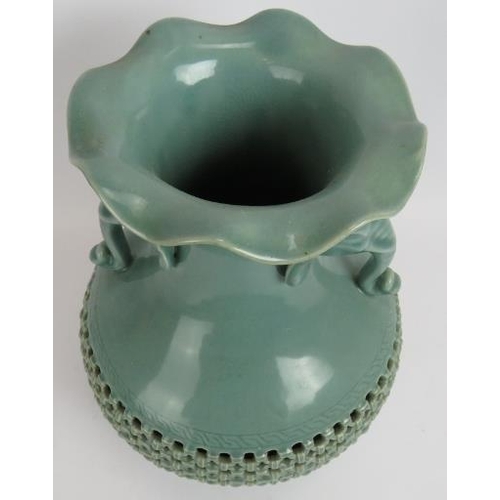 66 - A Chinese celadon glaze porcelain baluster vase of double wall construction with reticulated outer a... 