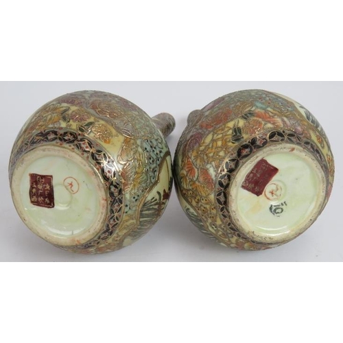 67 - A pair of Japanese porcelain Satsuma bottle vases richly decorated with gilt and polychrome colours.... 