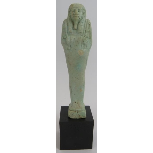 7 - An ancient Egyptian faience ushabti decorated in light blue glaze, believed to be c1070-945 BC. Cert... 