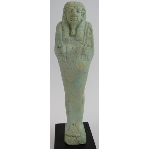 7 - An ancient Egyptian faience ushabti decorated in light blue glaze, believed to be c1070-945 BC. Cert... 