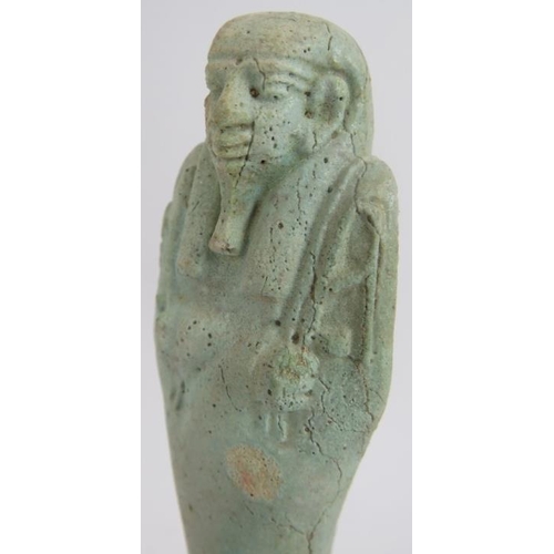 7 - An ancient Egyptian faience ushabti decorated in light blue glaze, believed to be c1070-945 BC. Cert... 