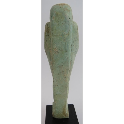 7 - An ancient Egyptian faience ushabti decorated in light blue glaze, believed to be c1070-945 BC. Cert... 