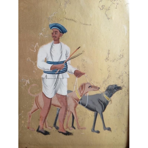 71 - An antique Indian painting on mica of a man and hounds mounted behind glass in a gilt mounted leathe... 