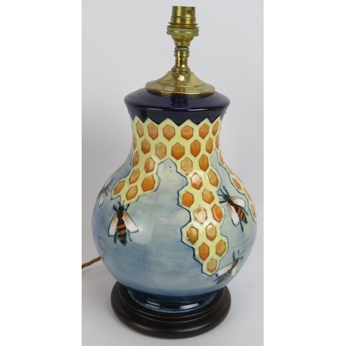 76 - A Moorcroft pottery honeycomb and bees lamp with original label and shade. Lamp base height 28cm.
Co... 