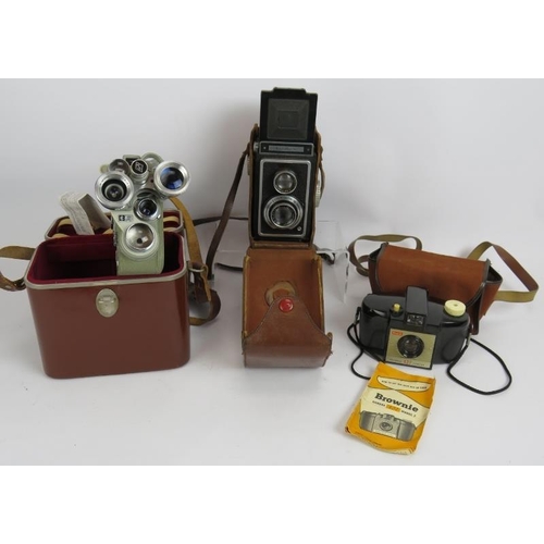 83 - An Ikoflex TLR camera with leather case, a Eumig C3R Cine camera with case and a Kodak Brownie 127 w... 