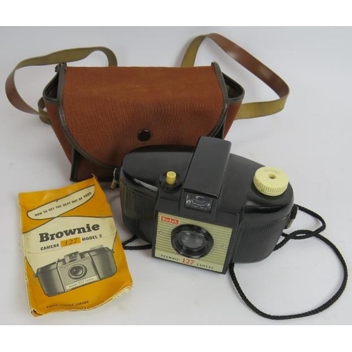 83 - An Ikoflex TLR camera with leather case, a Eumig C3R Cine camera with case and a Kodak Brownie 127 w... 