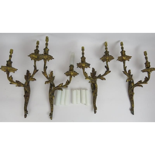 87 - Two pairs of good quality gilt brass rococo acanthus leaf double branch wall sconces with white glas... 