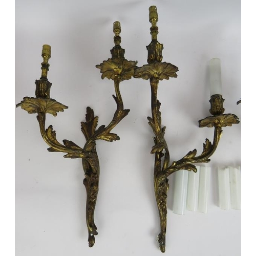 87 - Two pairs of good quality gilt brass rococo acanthus leaf double branch wall sconces with white glas... 