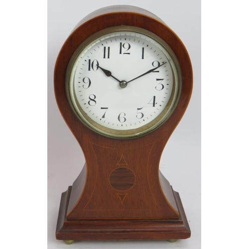 89 - A small Edwardian baloon shaped mantle clock with inlaid walnut case and French movement. No key. He... 