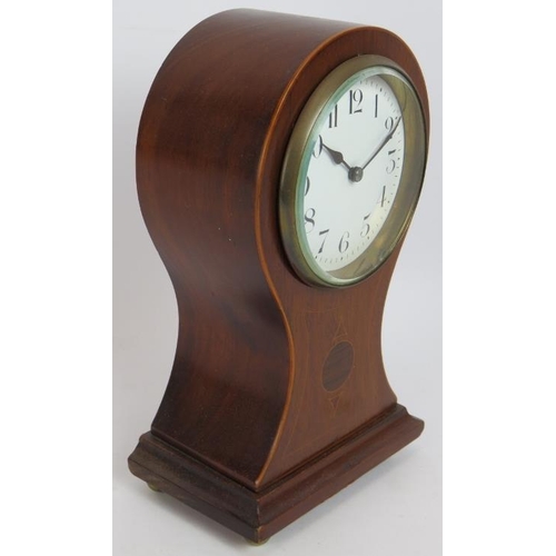 89 - A small Edwardian baloon shaped mantle clock with inlaid walnut case and French movement. No key. He... 