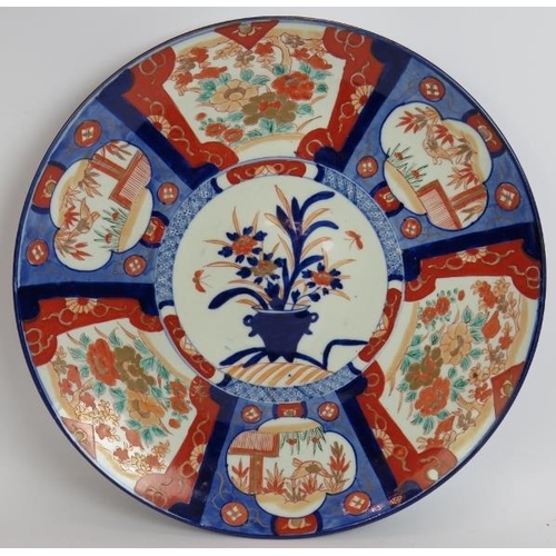 96 - A large Japanese porcelain charger decorated in Imari colours, 20th century. Diameter 47cm.
Conditio... 