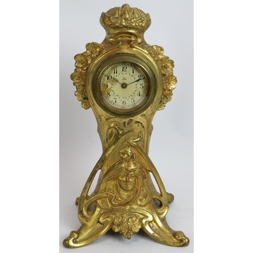 98 - An antique Art Nouveau French gilt metal clock with case designed by C Bonnefond. Height 31.5cm.
Con... 