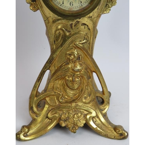 98 - An antique Art Nouveau French gilt metal clock with case designed by C Bonnefond. Height 31.5cm.
Con... 