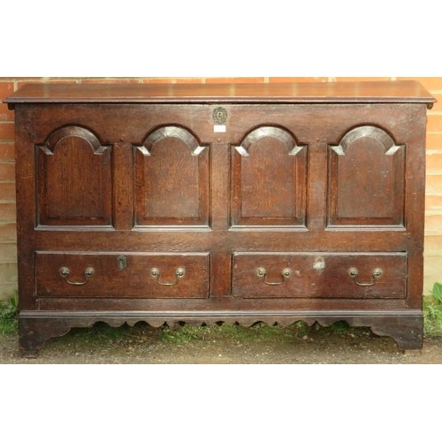 701 - An 18th century oak mule chest, featuring an internal candle box with two small drawers under, the f... 