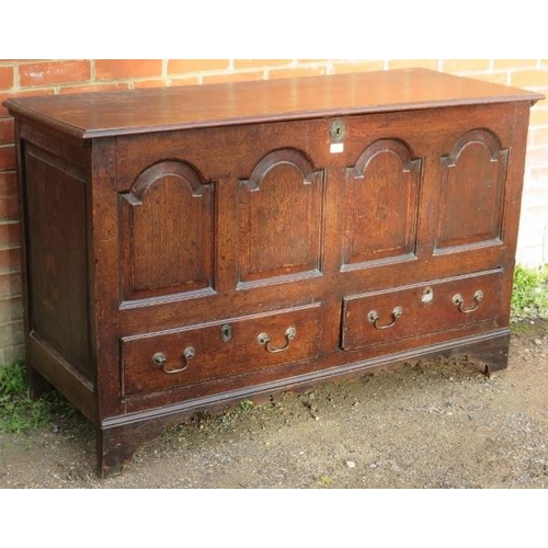 701 - An 18th century oak mule chest, featuring an internal candle box with two small drawers under, the f... 