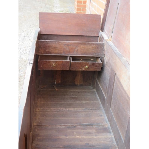 701 - An 18th century oak mule chest, featuring an internal candle box with two small drawers under, the f... 