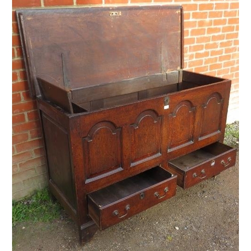 701 - An 18th century oak mule chest, featuring an internal candle box with two small drawers under, the f... 