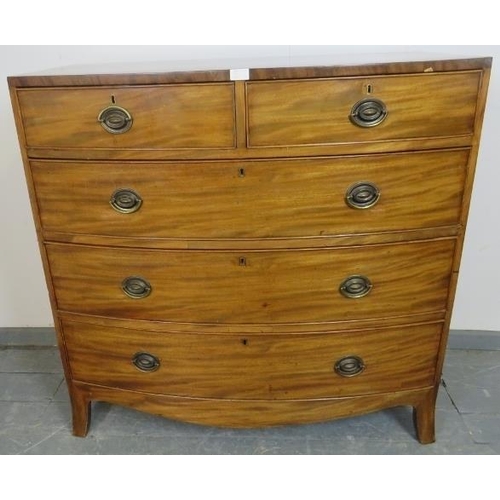 702 - A George III mahogany bow-fronted chest of two short over three long graduated cock-beaded drawers w... 