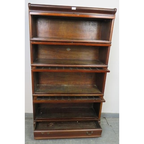 703 - A vintage mahogany Globe-Wernicke stacking bookcase of four graduated sections, the glazed doors wit... 