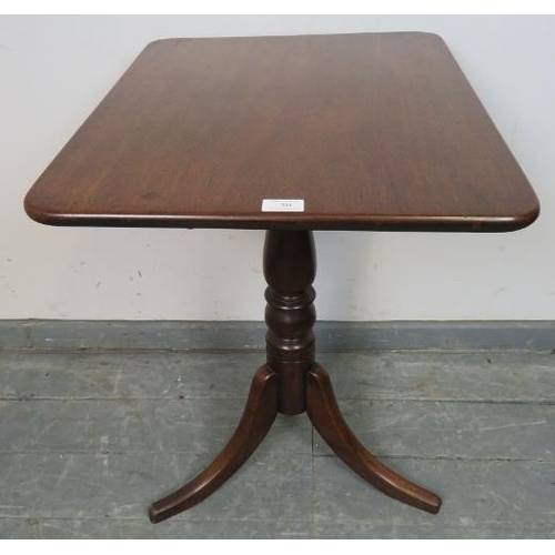 704 - A Victorian mahogany rectangular tilt-top wine table, on a baluster turned column with splayed tripo... 