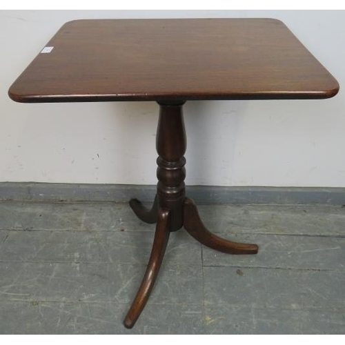 704 - A Victorian mahogany rectangular tilt-top wine table, on a baluster turned column with splayed tripo... 