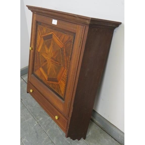 707 - A vintage wall hanging cabinet, the panelled door featuring starburst parquetry inlay with one long ... 