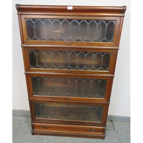 708 - A vintage mahogany Globe-Wernicke stacking bookcase of four graduated sections, the glazed doors wit... 