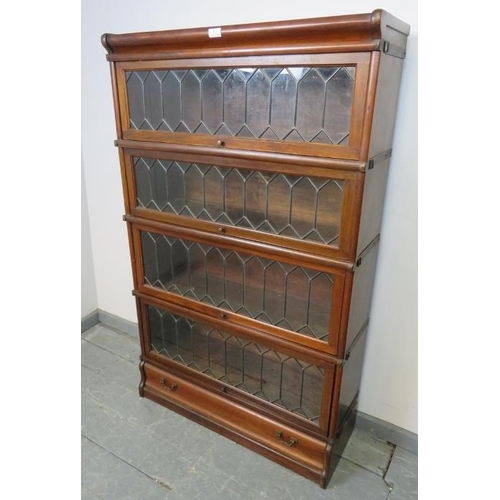 708 - A vintage mahogany Globe-Wernicke stacking bookcase of four graduated sections, the glazed doors wit... 