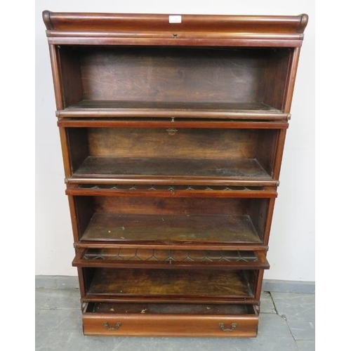 708 - A vintage mahogany Globe-Wernicke stacking bookcase of four graduated sections, the glazed doors wit... 