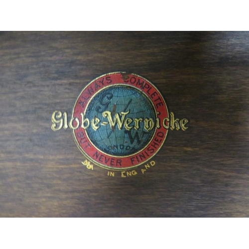 708 - A vintage mahogany Globe-Wernicke stacking bookcase of four graduated sections, the glazed doors wit... 