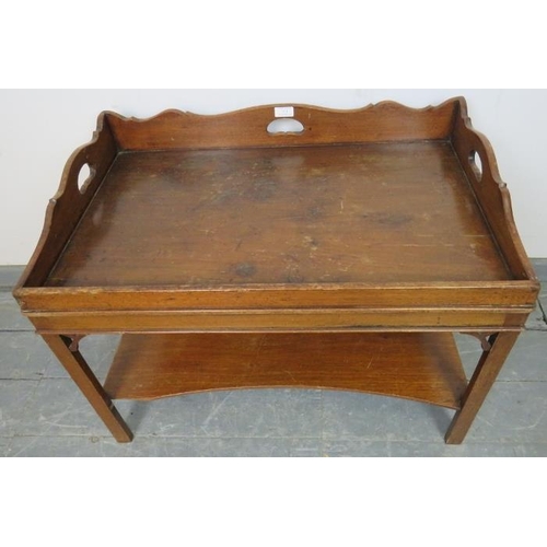 711 - A Georgian design mahogany butler’s tray coffee table with shaped ¾ gallery, on inner chamfered squa... 