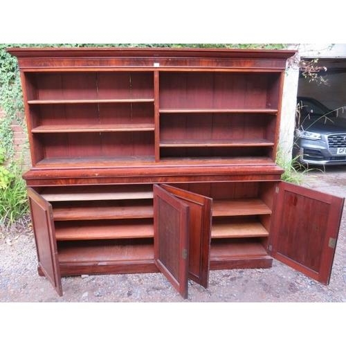 716 - A very large Victorian mahogany bookcase, of four height adjustable open shelves above four cupboard... 