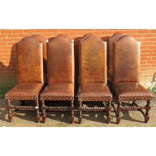 717 - Eight antique style high back dining chairs, upholstered in distressed brown leather with large bras... 