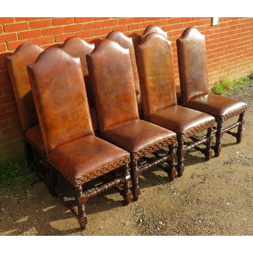 717 - Eight antique style high back dining chairs, upholstered in distressed brown leather with large bras... 