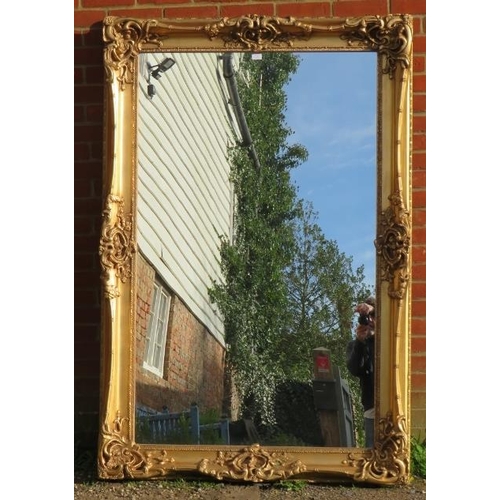 718 - A large 19th century style wall mirror in a very ornate gilt gesso moulded frame. 
Condition report:... 