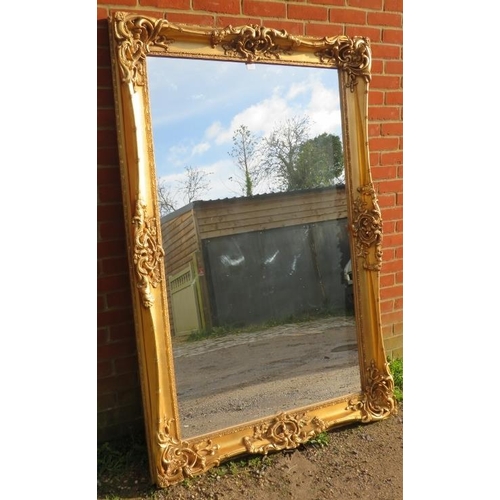 718 - A large 19th century style wall mirror in a very ornate gilt gesso moulded frame. 
Condition report:... 