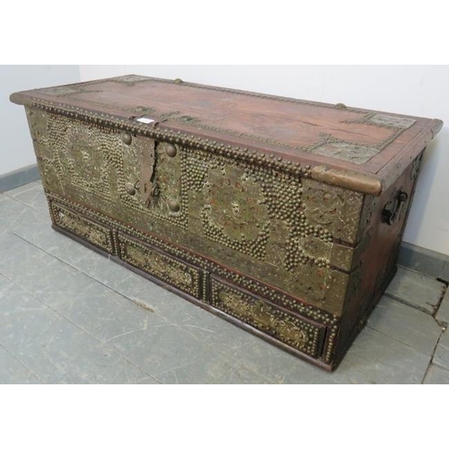 721 - A 19th century hardwood Zanzibar chest, featuring pierced brass decoration and a multitude of brass ... 