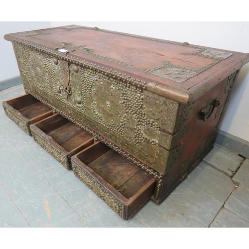 721 - A 19th century hardwood Zanzibar chest, featuring pierced brass decoration and a multitude of brass ... 