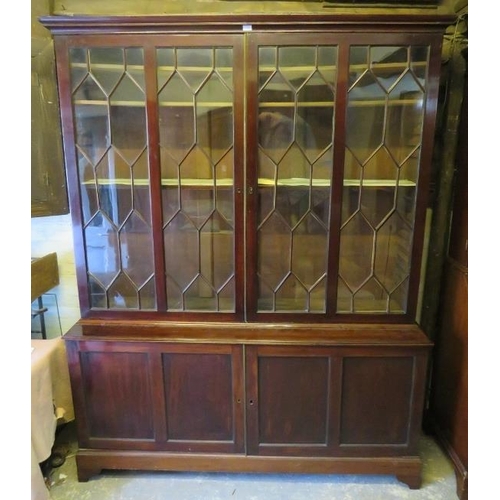 722 - A George III Cuban mahogany tall glazed bookcase, the astral glazed doors opening onto three height ... 