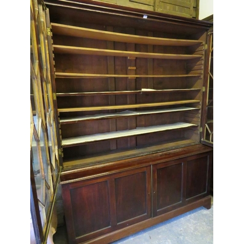 722 - A George III Cuban mahogany tall glazed bookcase, the astral glazed doors opening onto three height ... 