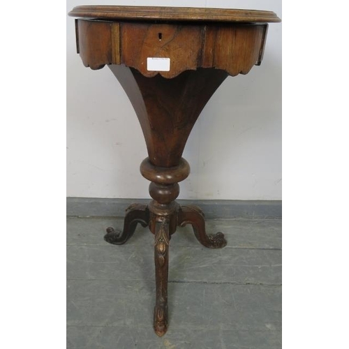 728 - A Victorian rosewood trumpet/work table, the circular lid opening onto an array of lidded compartmen... 