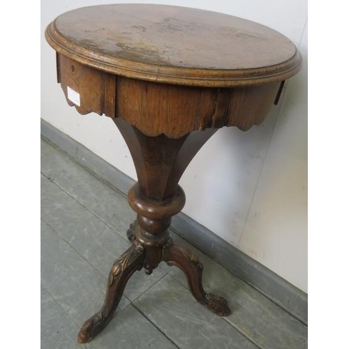 728 - A Victorian rosewood trumpet/work table, the circular lid opening onto an array of lidded compartmen... 