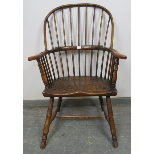 729 - A good 18th century elm Windsor hoop back chair, on turned canted supports with an ‘H’ stretcher. c1... 