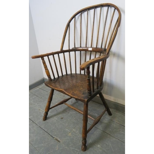 729 - A good 18th century elm Windsor hoop back chair, on turned canted supports with an ‘H’ stretcher. c1... 