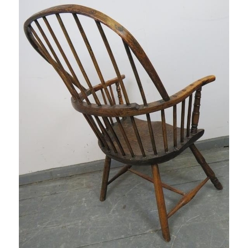 729 - A good 18th century elm Windsor hoop back chair, on turned canted supports with an ‘H’ stretcher. c1... 